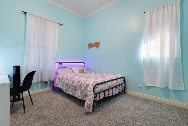 bedroom with ornamental molding and carpet