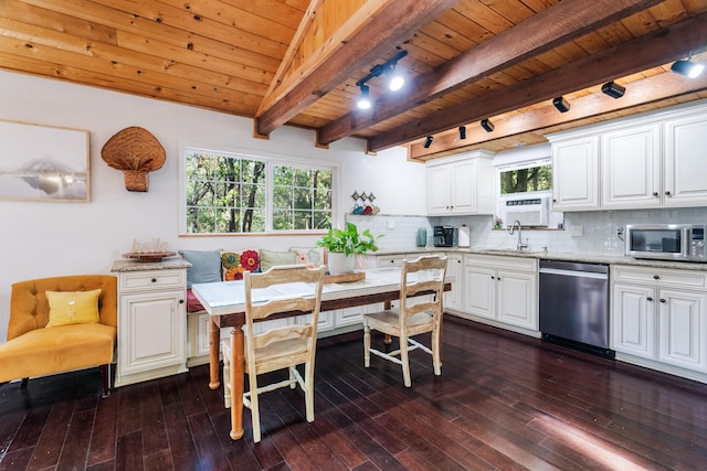 30570 Sleepy Hollow Dr, Shingletown, CA 96088 - kitchen with stainless steel appliances, a wood ceiling with exposed beams, rail lighting, dark wood-style floors, and breakfast area