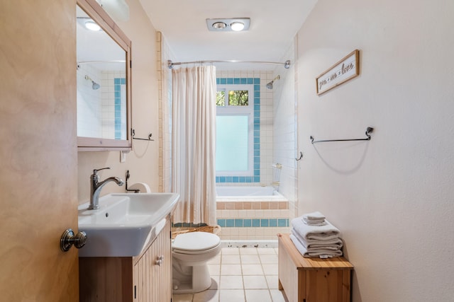 full bathroom with shower / tub combo with curtain, vanity, tile patterned floors, and toilet