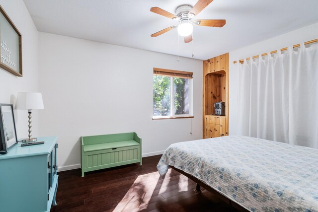 30570 Sleepy Hollow Dr, Shingletown, CA 96088 - bedroom featuring dark wood-type flooring and ceiling fan