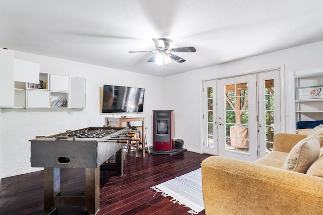 interior space featuring ceiling fan and dark hardwood / wood-style flooring