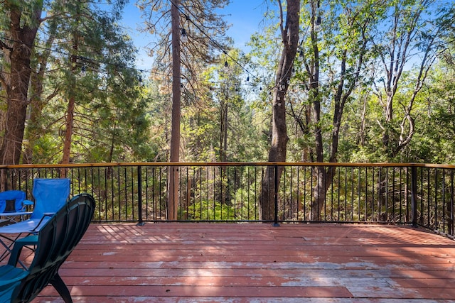 30570 Sleepy Hollow Dr, Shingletown, CA 96088 - wooden deck featuring a view of trees