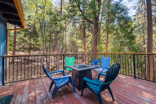 wooden deck featuring a fire pit