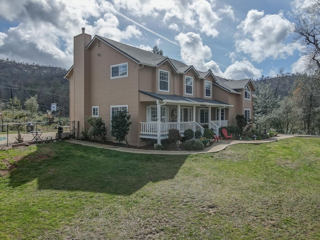 view of front facade with a porch and a front lawn