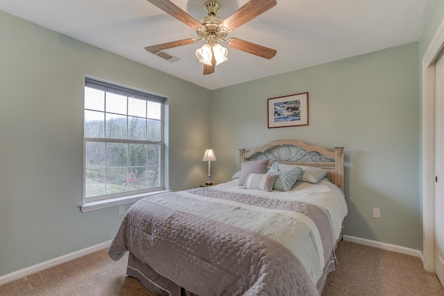 bedroom with ceiling fan, a closet, and carpet