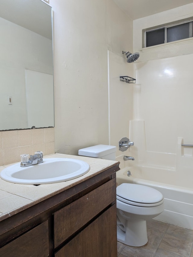 full bathroom with toilet, vanity, shower / bath combination, and decorative backsplash