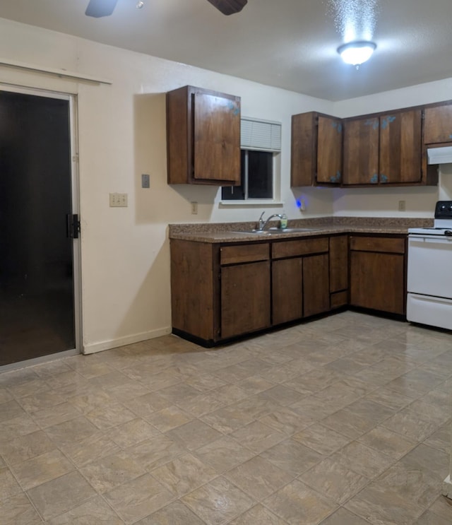 kitchen featuring white electric stove, dark brown cabinets, and ceiling fan