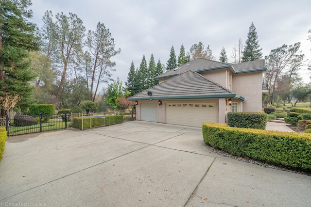 view of side of home with a garage