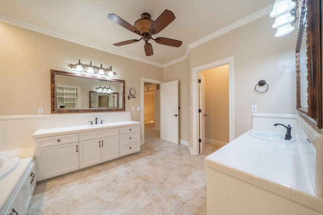 bathroom with ceiling fan, vanity, a bathtub, and crown molding