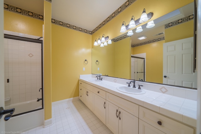 bathroom with shower / bath combination with glass door, vanity, and tile patterned floors