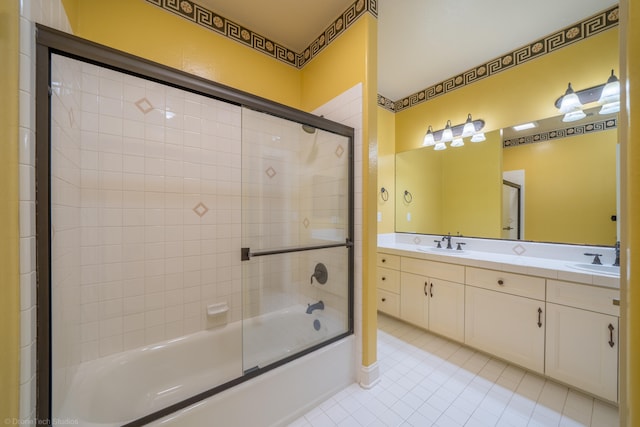 bathroom featuring combined bath / shower with glass door, vanity, and tile patterned floors