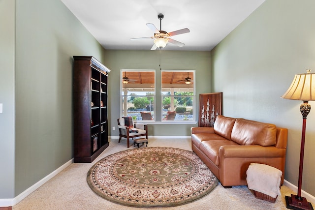 living area featuring ceiling fan and carpet flooring