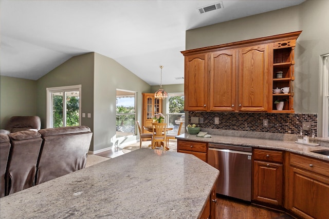 kitchen with dark hardwood / wood-style floors, decorative light fixtures, stainless steel dishwasher, and a healthy amount of sunlight