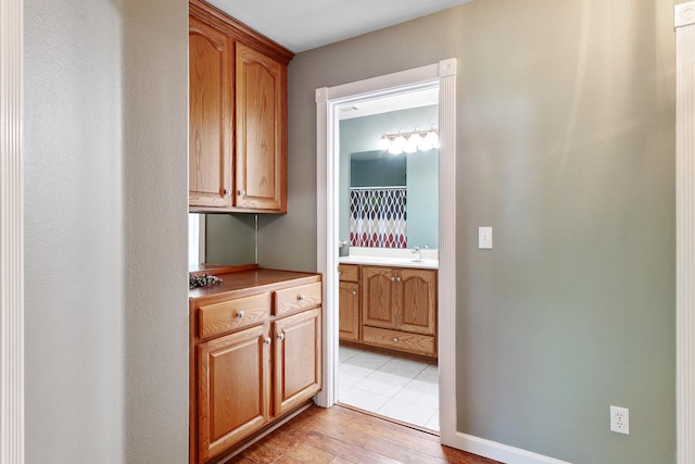 kitchen featuring sink and light wood-type flooring