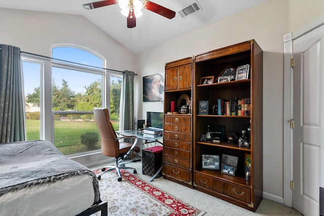 bedroom with lofted ceiling, ceiling fan, and light colored carpet