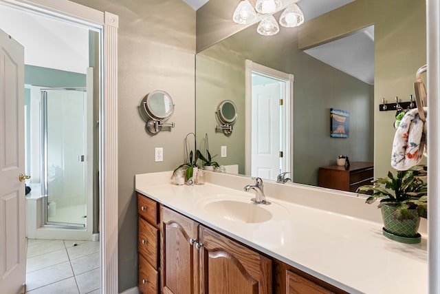 bathroom with an enclosed shower, tile patterned floors, and vanity