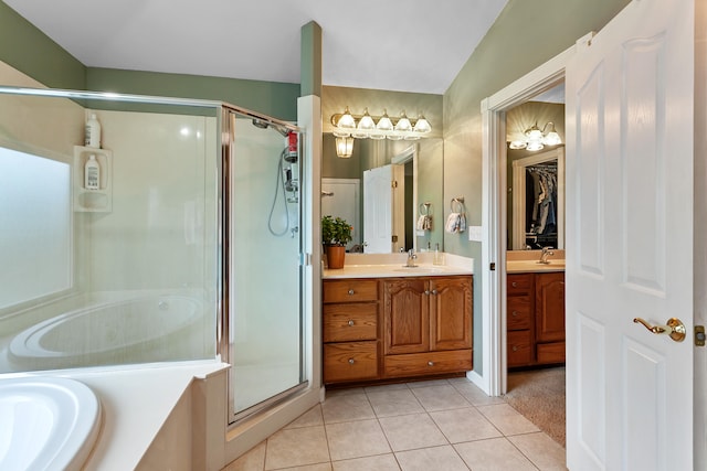 bathroom with vaulted ceiling, tile patterned flooring, separate shower and tub, and vanity