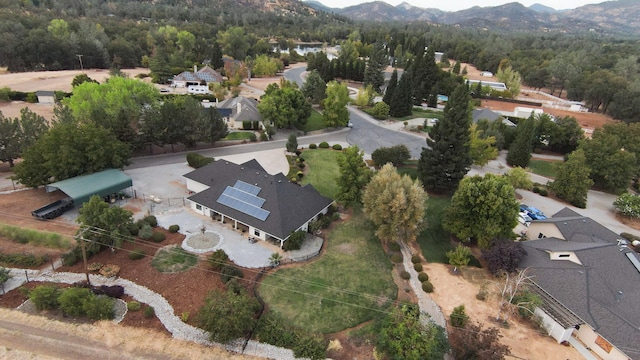 birds eye view of property with a mountain view