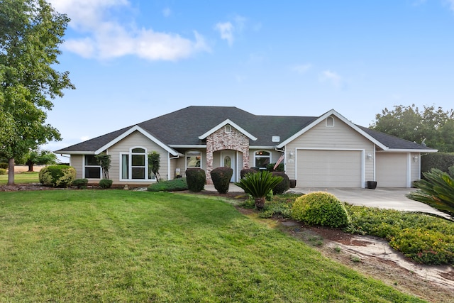 ranch-style house with a garage and a front lawn