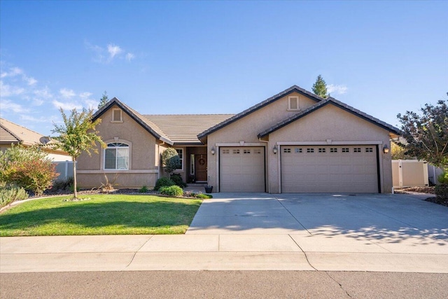 ranch-style home with a front lawn and a garage