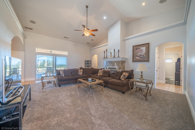 carpeted living room featuring high vaulted ceiling and ceiling fan