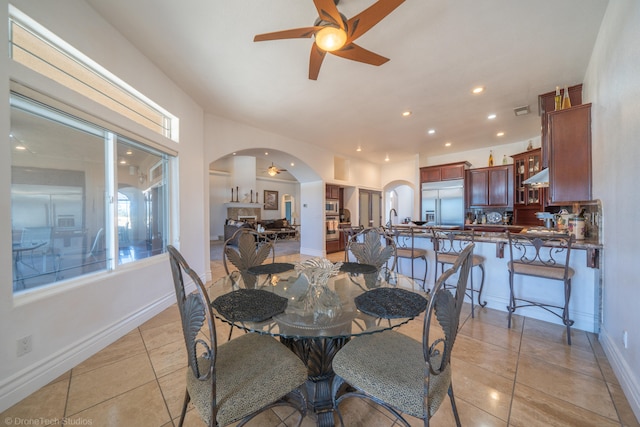 dining room with ceiling fan and light tile patterned floors