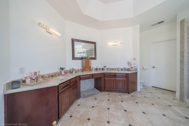 bathroom with vanity and toilet