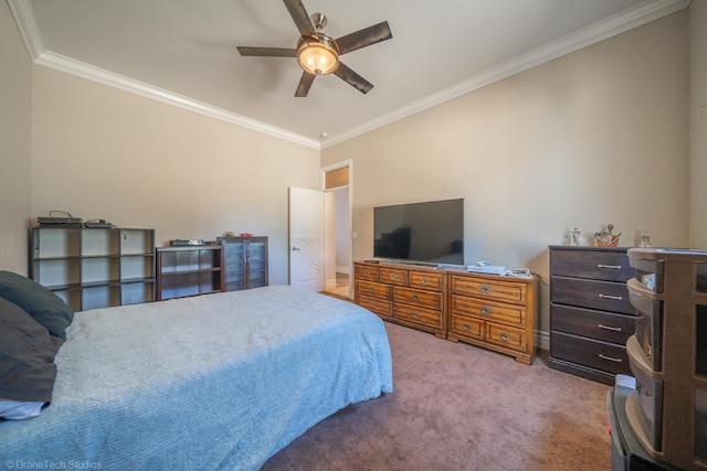 bedroom featuring ceiling fan, crown molding, and carpet