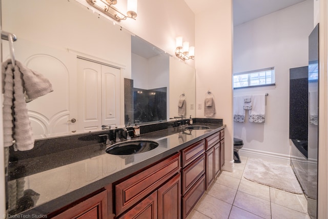 bathroom featuring tile patterned floors, vanity, and toilet