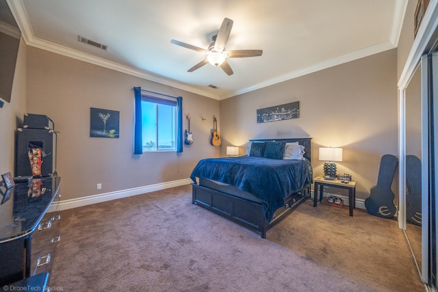 carpeted bedroom featuring ceiling fan and ornamental molding