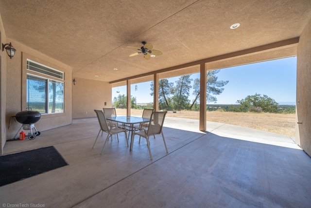 view of patio with grilling area and ceiling fan