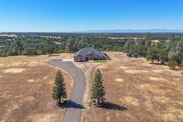 birds eye view of property with a mountain view