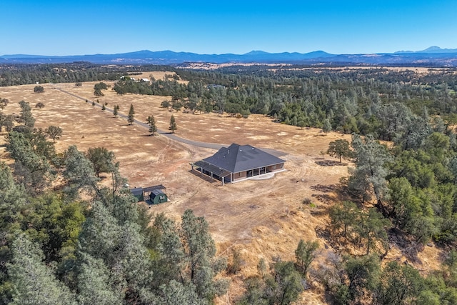 birds eye view of property with a mountain view and a rural view