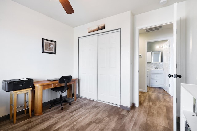 office with ceiling fan, hardwood / wood-style floors, and sink