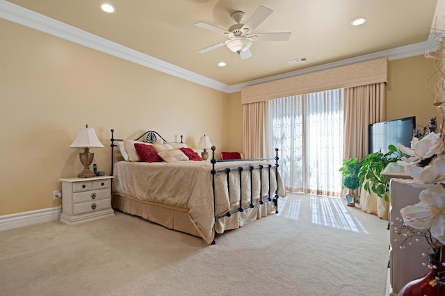 carpeted bedroom featuring ornamental molding and ceiling fan