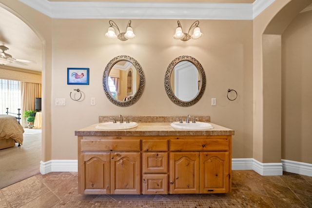 bathroom featuring ceiling fan, vanity, and crown molding