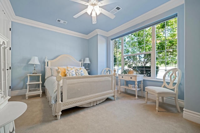 bedroom featuring carpet floors, ornamental molding, and ceiling fan