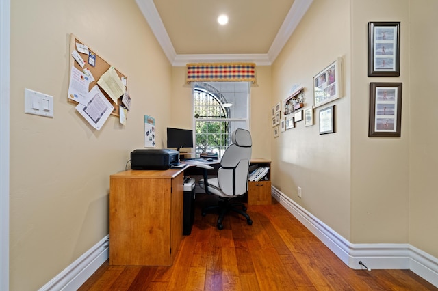 home office featuring ornamental molding and dark wood-type flooring