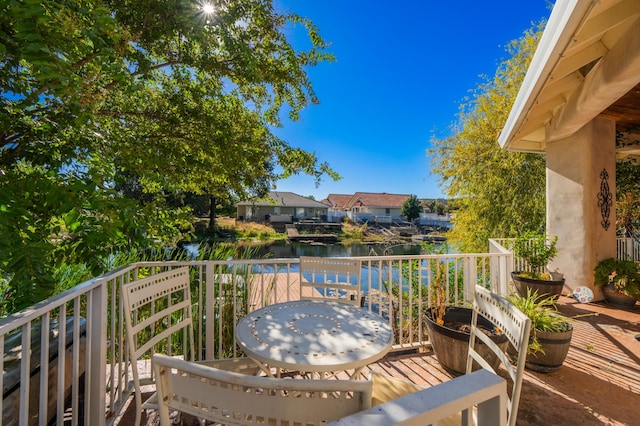 balcony featuring a water view