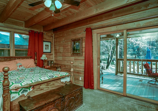 carpeted bedroom with beam ceiling, wood walls, access to outside, ceiling fan, and wooden ceiling