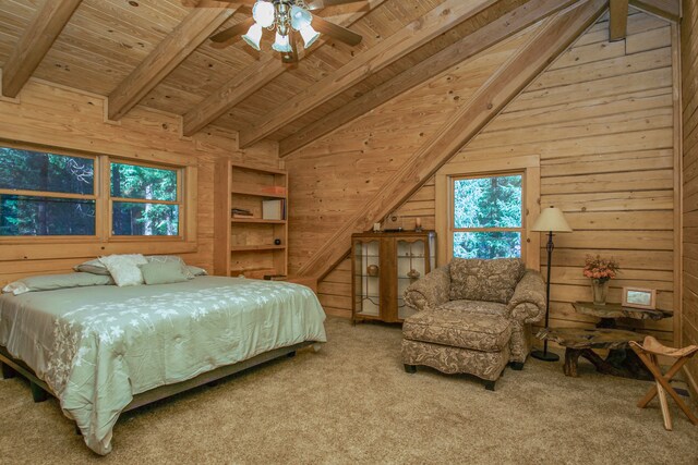 carpeted bedroom featuring ceiling fan, wooden walls, lofted ceiling with beams, and wooden ceiling