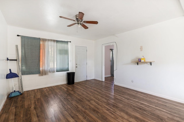 unfurnished living room featuring dark hardwood / wood-style flooring and ceiling fan