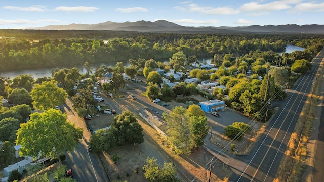 bird's eye view with a water and mountain view