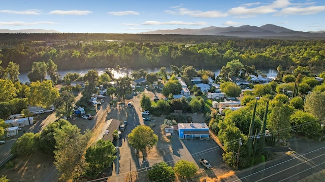 bird's eye view featuring a water and mountain view