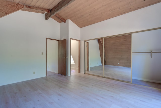 unfurnished bedroom featuring wood ceiling, a closet, light wood-type flooring, high vaulted ceiling, and beam ceiling