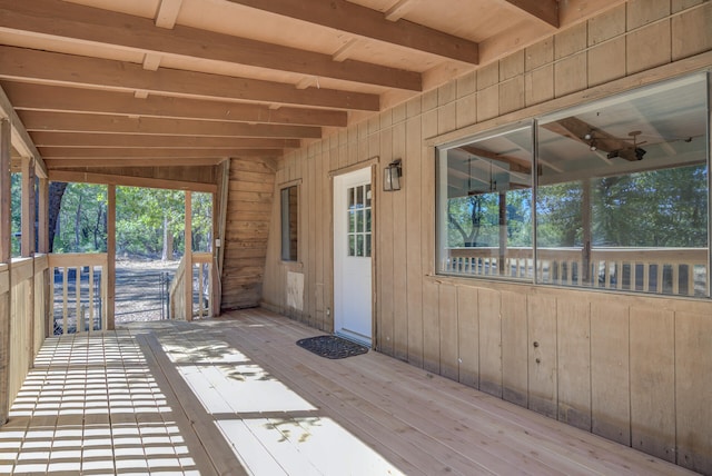 wooden terrace featuring ceiling fan