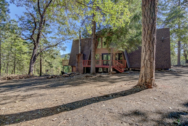 view of front of home featuring a wooden deck