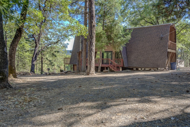 view of front facade featuring a wooden deck