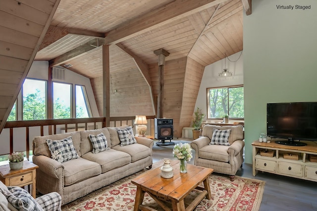 living room with a healthy amount of sunlight, wood ceiling, lofted ceiling with beams, and a wood stove