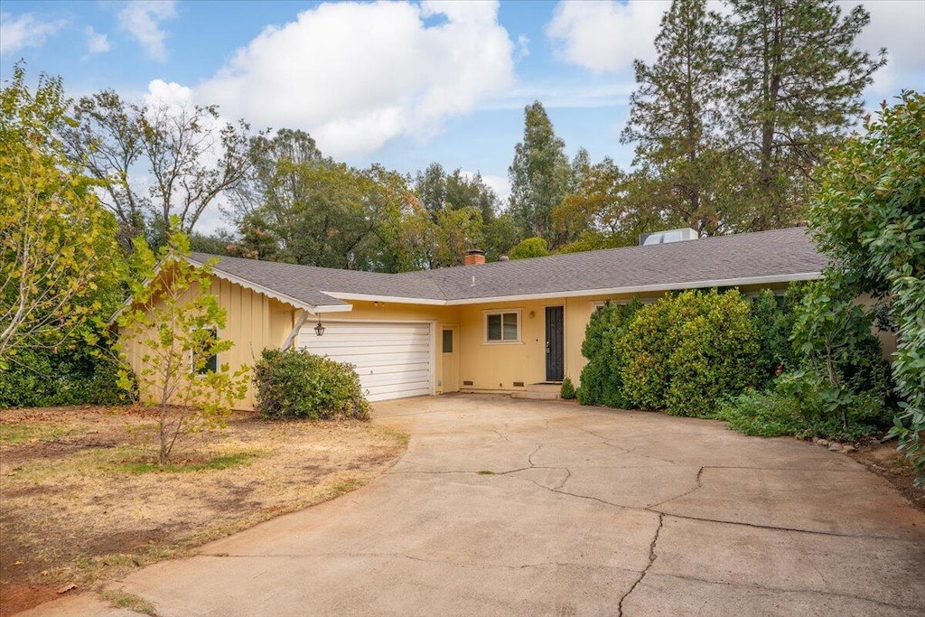 single story home featuring a garage